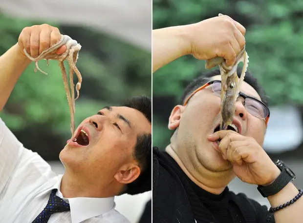 Sul-coreanos comem polvos vivos em festival gastronômico (Foto: Jung Yeon-je/AFP)